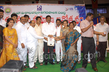 Minister presents Gold coin to  Bangaru Lakshmi winner