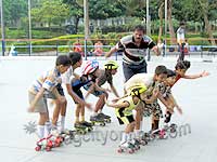 Kids learning skating at a summer camp