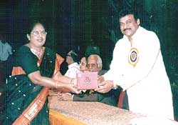 Ms. Lakshmi receives award from Film actor Mr. Chiranjeevi