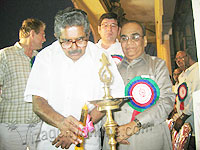 V. Ravi, MP, lighting the lamp