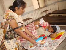 sri sathya sai mahila presenting new clothes and toiletary kits to new born at ghosha hospital
