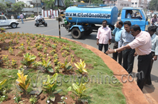 Commissioner inspecting greenary at traffic island