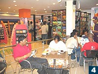Customers getting a taste of the goodies at Cafe Coffee Day