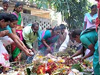 People performing poojas on the occasion of Nagula Chavithi